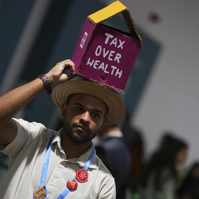 Protesters gather at UN climate talks in global day of action as progress on a deal slows
